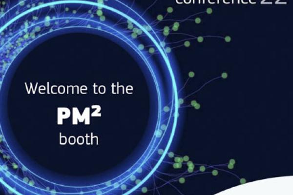An abstract digital circle with text "Welcome to the PM² booth", logo of the SEMIC Conference and the Centre of Excellence in PM²