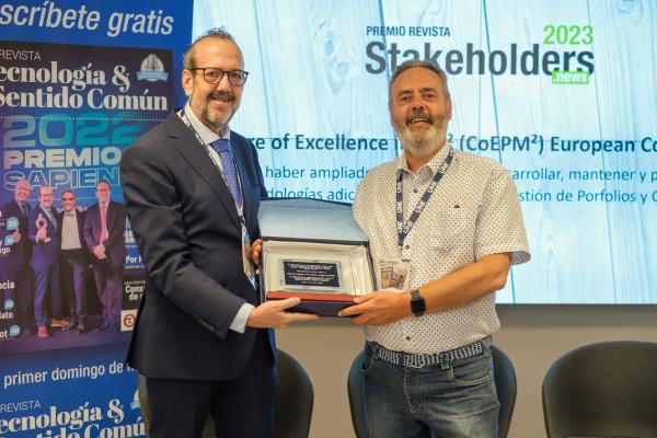 A professional from the PM² team receiving an award at an official event